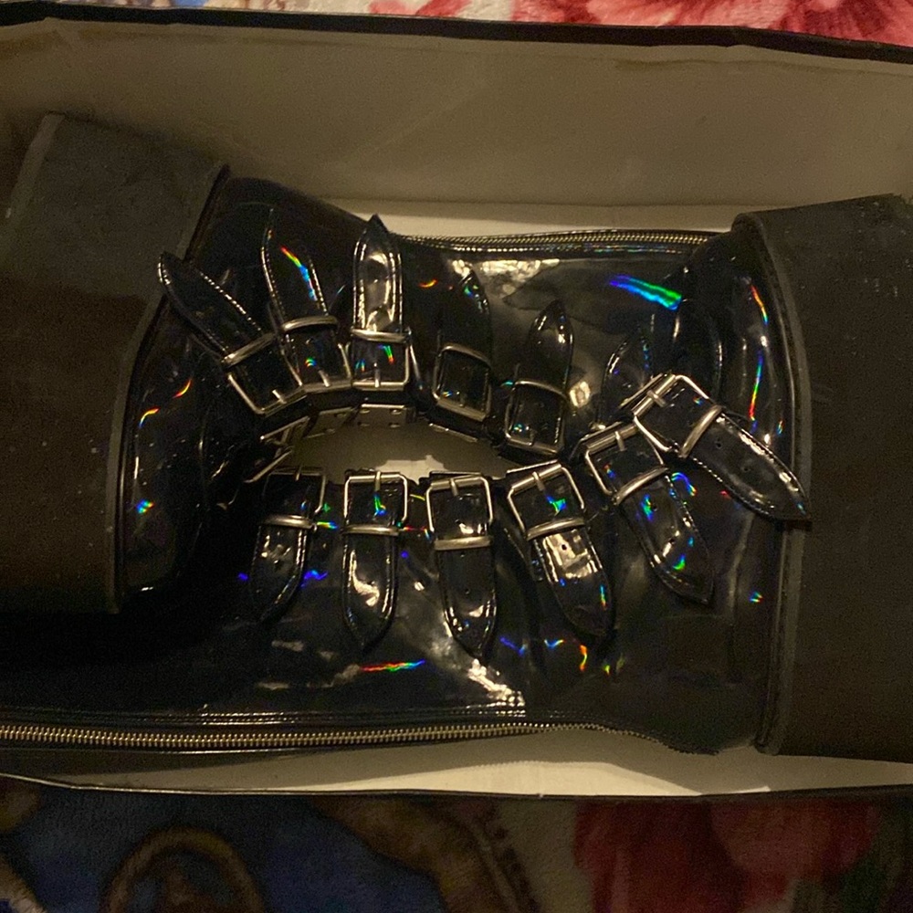 Demonia Black, hologram, size women’s 6 platforms, buckles going down shoe